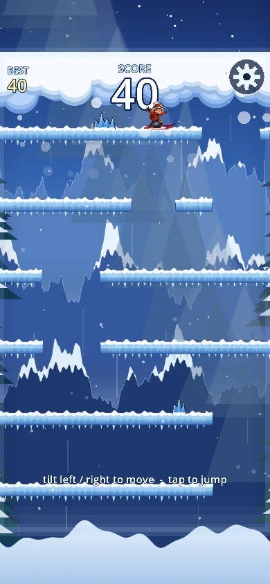 Gameplay: a rider on icy ledges with ice spikes, score 40, and the hint tilt left or right to move, tap to jump